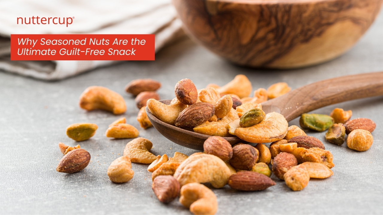 Wooden spoon filled with seasoned nuts including almonds, cashews, and pistachios on a textured surface - Nuttercup